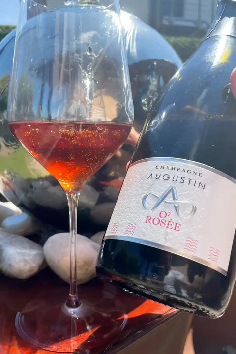 Champagne Augustin - O2 Rosée bottle and glass- Natural Wine Dealers