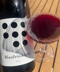 Weninger Blaufränkisch 2020 bottle and glass - Natural Wine Dealers