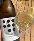 Weninger Furmint vom Kalk 2023 bottle and glass - Natural Wine Dealers