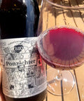 Weninger Ponzichter 2023 bottle and glass- Natural Wine Dealers